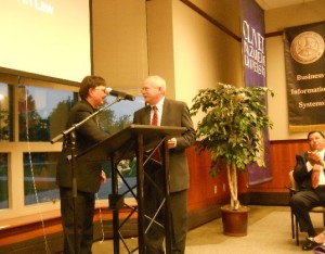 Dr. Fred Beuttler accepts the Center's 2015 Christian Citizenship Award from Dr. Charlie Emmerich on behalf of his parents, Fred and Doris Beuttler.